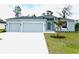 Charming single-Gathering home with a three-car garage and a well-maintained lawn at 5082 Rilke Ln, Port Charlotte, FL 33981