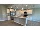 Well-equipped kitchen with a center island, stainless appliances, and ample storage at 5082 Rilke Ln, Port Charlotte, FL 33981