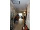 Inviting hallway with neutral tile and direct access to the living room at 5106 26Th Street W Ct # 5106, Bradenton, FL 34207