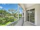 Relax on the tiled balcony, overlooking the lake with beautiful fountain and mature trees at 5242 Manorwood Dr Dr # 3A, Sarasota, FL 34235