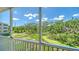 Private balcony offering views of the pond and lush natural surroundings at 5242 Manorwood Dr Dr # 3A, Sarasota, FL 34235