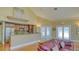 Clubhouse kitchen featuring stainless steel appliances, a breakfast bar, and bright lighting at 5242 Manorwood Dr Dr # 3A, Sarasota, FL 34235