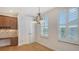Cozy dining room with adjacent butler's pantry, featuring white plantation shutters at 5242 Manorwood Dr Dr # 3A, Sarasota, FL 34235