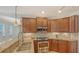 Gourmet kitchen featuring stainless appliances, granite counters, and ample cabinet space at 5242 Manorwood Dr Dr # 3A, Sarasota, FL 34235