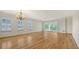 Spacious open-concept living room featuring beautiful floors, neutral tones, and natural light at 5242 Manorwood Dr Dr # 3A, Sarasota, FL 34235