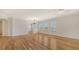 Spacious and bright living room featuring gleaming hardwood floors and plantation shutters at 5242 Manorwood Dr Dr # 3A, Sarasota, FL 34235