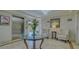 Elegant lobby with marble floors, stylish furniture and artwork at 5242 Manorwood Dr Dr # 3A, Sarasota, FL 34235