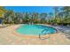 Resort-style pool with ample seating and lush landscaping at 5242 Manorwood Dr Dr # 3A, Sarasota, FL 34235