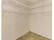 Walk-in closet with wire shelving at 5601 Bentgrass Dr # 10-105, Sarasota, FL 34235