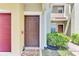 Inviting entrance with a warm welcome mat and a view of the townhome complex at 5601 Bentgrass Dr # 10-105, Sarasota, FL 34235