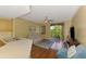Comfortable living room with modern furnishings and a sliding door to the private balcony at 5601 Bentgrass Dr # 10-105, Sarasota, FL 34235