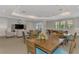 Inviting lounge featuring multiple tables, a seating area, and a pool table, creating a welcoming space at 5601 Bentgrass Dr # 10-105, Sarasota, FL 34235