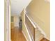 Inviting staircase with wood and carpeted steps, leading to the upper level of the home at 5601 Bentgrass Dr # 10-105, Sarasota, FL 34235