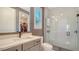 Contemporary bathroom with a glass-enclosed shower, sleek vanity, and stylish tile accents at 5793 Long Shore Loop, Sarasota, FL 34238