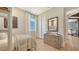 Bright bedroom with a modern dresser, closet, and a comfortable bed by a sunny window at 5793 Long Shore Loop, Sarasota, FL 34238