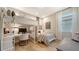 Cozy bedroom with bunk beds, a built-in desk area, and soft natural light from the window at 5793 Long Shore Loop, Sarasota, FL 34238