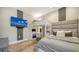 Shared bedroom featuring bunk beds, individual work stations, and a mounted television for entertainment at 5793 Long Shore Loop, Sarasota, FL 34238