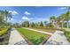Enjoy a leisurely game of bocce ball on well-maintained courts, surrounded by lush landscaping at 5793 Long Shore Loop, Sarasota, FL 34238