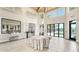 Spacious clubhouse foyer with high ceilings, modern decor, and views of the pool area at 5793 Long Shore Loop, Sarasota, FL 34238