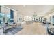 Open concept clubhouse featuring comfortable seating, a kitchen area, and dining tables at 5793 Long Shore Loop, Sarasota, FL 34238