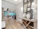 Entryway with hardwood floors, high ceilings, modern decor and a peek into the open concept living space at 5793 Long Shore Loop, Sarasota, FL 34238