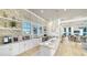 Entertain in style with a beautiful kitchenette offering plenty of counter space and elegant lighting in community clubhouse at 5793 Long Shore Loop, Sarasota, FL 34238