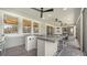 Outdoor kitchen with a large granite countertop bar for entertaining and dining outdoors at 5793 Long Shore Loop, Sarasota, FL 34238