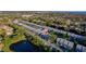 Aerial shot of condos featuring lush greenery, ponds, and a community pool at 6033 34Th W St # 132, Bradenton, FL 34210