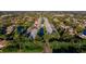 Aerial view of community with gray townhomes surrounding ponds, driveways, and green landscaping at 6033 34Th W St # 132, Bradenton, FL 34210