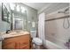 Cozy bathroom featuring a shower-tub combo, single sink with wooden cabinet, and neutral wall color at 6033 34Th W St # 132, Bradenton, FL 34210