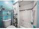 Bathroom featuring a toilet, shower-tub combo with shower curtain, and a shelving rack for storage at 6033 34Th W St # 132, Bradenton, FL 34210