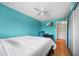 Cozy bedroom featuring wood floors, TV, and ample closet space at 6033 34Th W St # 132, Bradenton, FL 34210