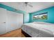 Inviting bedroom with wood floors, a ceiling fan, and a spacious closet at 6033 34Th W St # 132, Bradenton, FL 34210