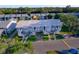 Exterior of grey condo units with white trim and grassy yards with parking in front at 6033 34Th W St # 132, Bradenton, FL 34210