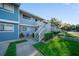 Charming two-story condo featuring a private patio area with green lawn and white stair railings at 6033 34Th W St # 132, Bradenton, FL 34210