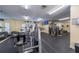 Modern gym equipped with exercise machines, weights, and mirrored walls for a comprehensive workout experience at 6033 34Th W St # 132, Bradenton, FL 34210