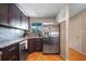 Bright kitchen with wood floors, stainless steel appliances, and a window offering natural light at 6033 34Th W St # 132, Bradenton, FL 34210