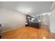 Open layout with the kitchen, featuring stainless steel appliances, wood floors, and ample space at 6033 34Th W St # 132, Bradenton, FL 34210