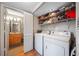A laundry room is adjacent to the bathroom and contains a washer and dryer at 6033 34Th W St # 132, Bradenton, FL 34210