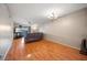 Bright living room featuring wood floors, ceiling fan, and access to the outdoors at 6033 34Th W St # 132, Bradenton, FL 34210