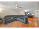 Spacious living room with a large sofa and wood flooring, adjacent to the kitchen at 6033 34Th W St # 132, Bradenton, FL 34210