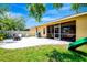 Well-maintained backyard featuring a patio, grill, and screened lanai at 6729 45Th E Ter, Bradenton, FL 34203