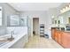 Bathroom featuring a separate shower, garden tub, and a double vanity at 6729 45Th E Ter, Bradenton, FL 34203