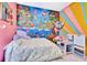 Charming bedroom featuring a large mural, hammock, and comfortable bed at 6729 45Th E Ter, Bradenton, FL 34203