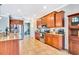 Spacious kitchen with stainless steel appliances, granite countertops, and ample cabinet space for storage at 6729 45Th E Ter, Bradenton, FL 34203