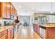Well-lit kitchen with stainless steel appliances and a dining area with natural light at 6729 45Th E Ter, Bradenton, FL 34203