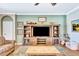 Cozy living room with a rustic entertainment center, comfortable seating, and warm, inviting decor at 6729 45Th E Ter, Bradenton, FL 34203