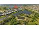 Aerial view of neighborhood with walking paths, ponds and serene water views at 6936 White Willow Ct, Sarasota, FL 34243