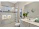 Clean bathroom with walk-in shower, and coastal decorative accents at 6936 White Willow Ct, Sarasota, FL 34243