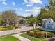 Manicured landscaping at the gated entrance to Magnolia Point community at 6936 White Willow Ct, Sarasota, FL 34243